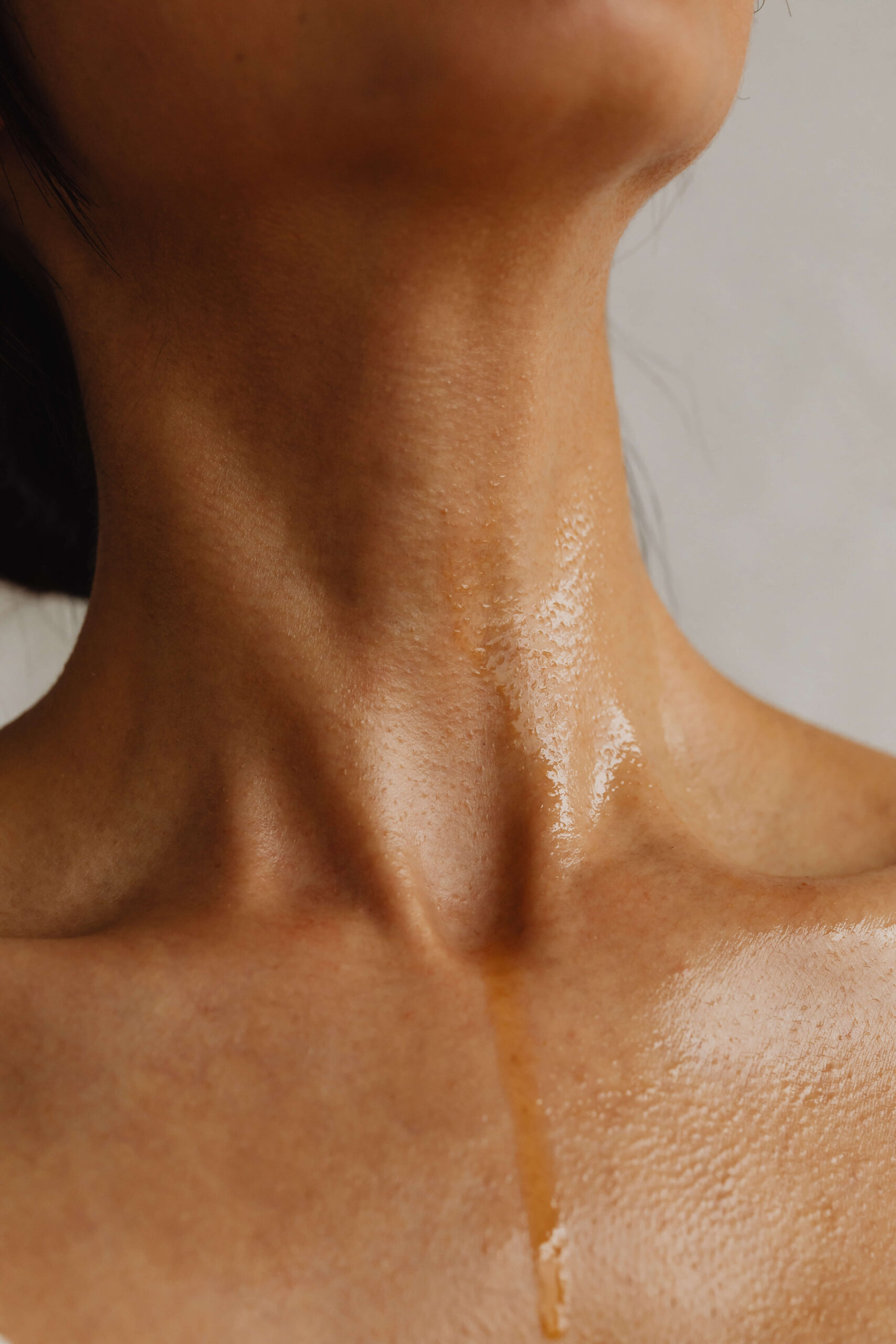 woman with oil on neck